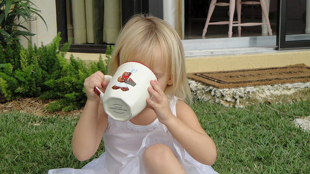 Child drinking coffee